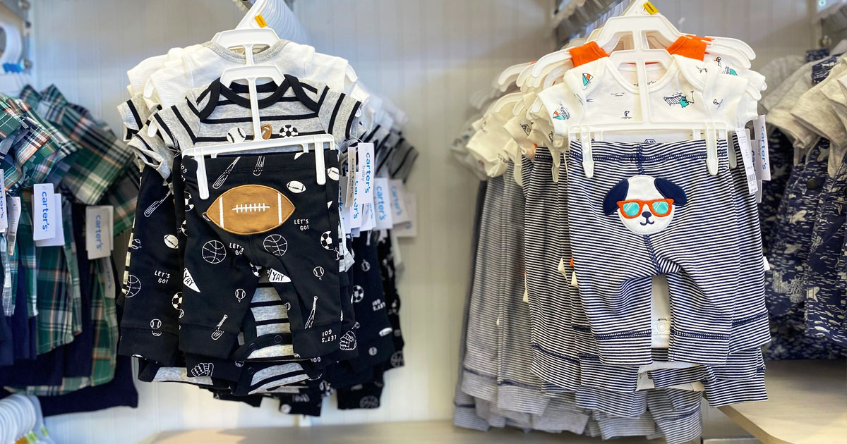 carter's baby outfit sets on display