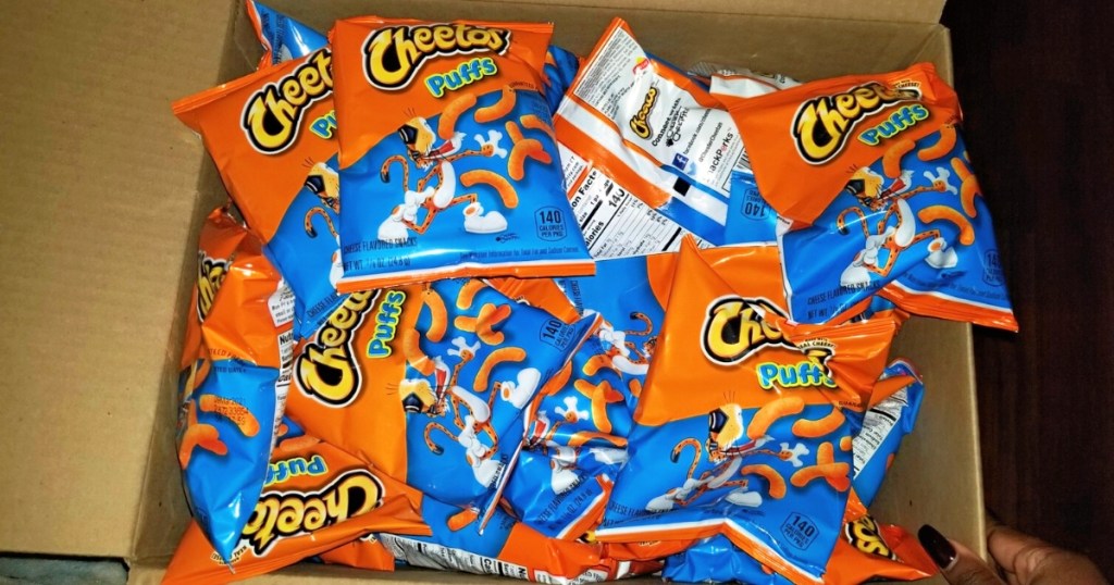 bags of cheetos puffs in a box