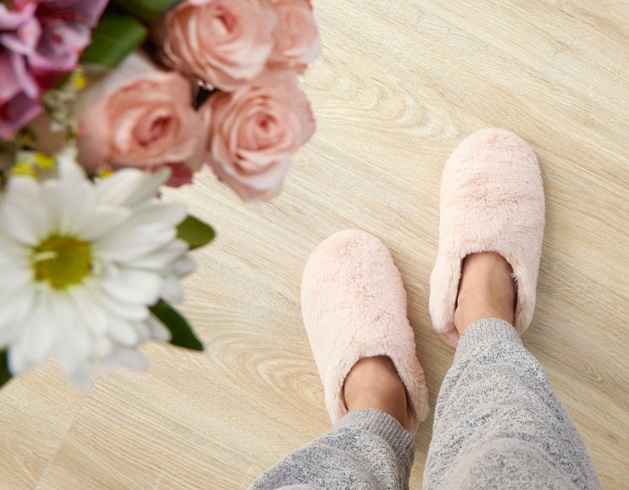 wearing pink fluffy slippers