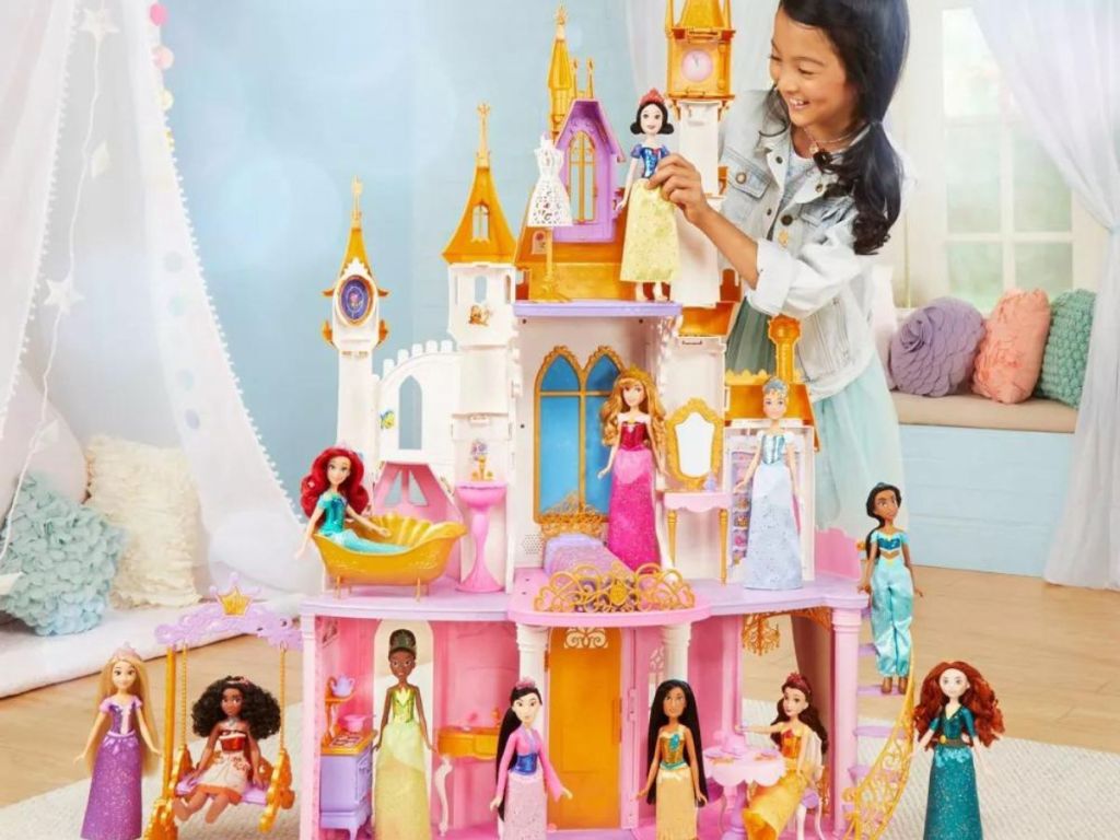 girl standing by a Disney Princess Castle