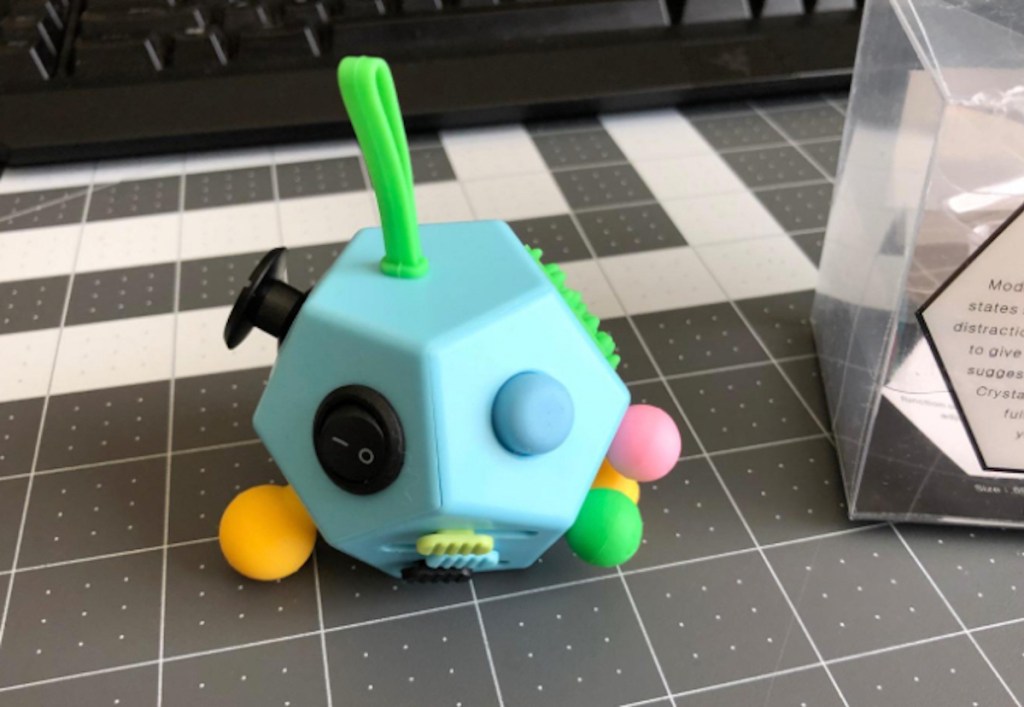 blue colorful amazon fidget toy on desk