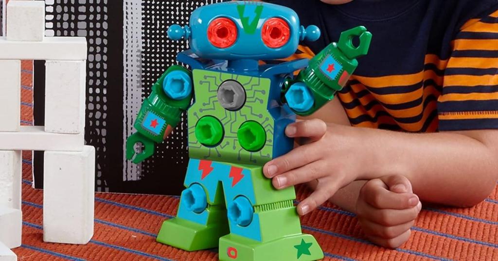 child playing with educational insights design and drill robot toy