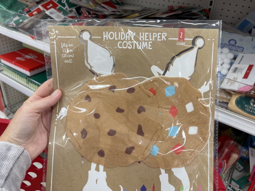 person holding up cookie costume for little elf in Target