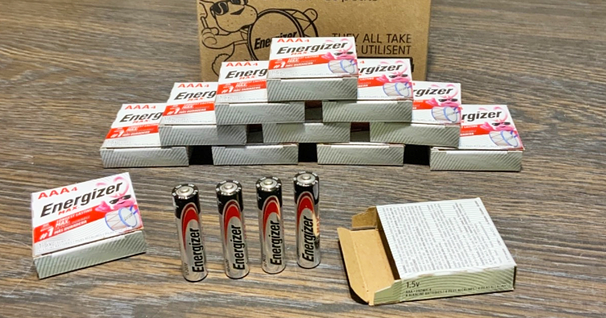 stack of energizer batteries on wood table