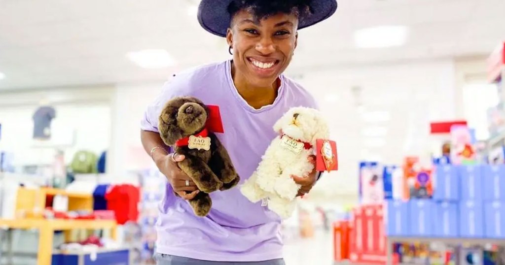 woman holding two plush dogs