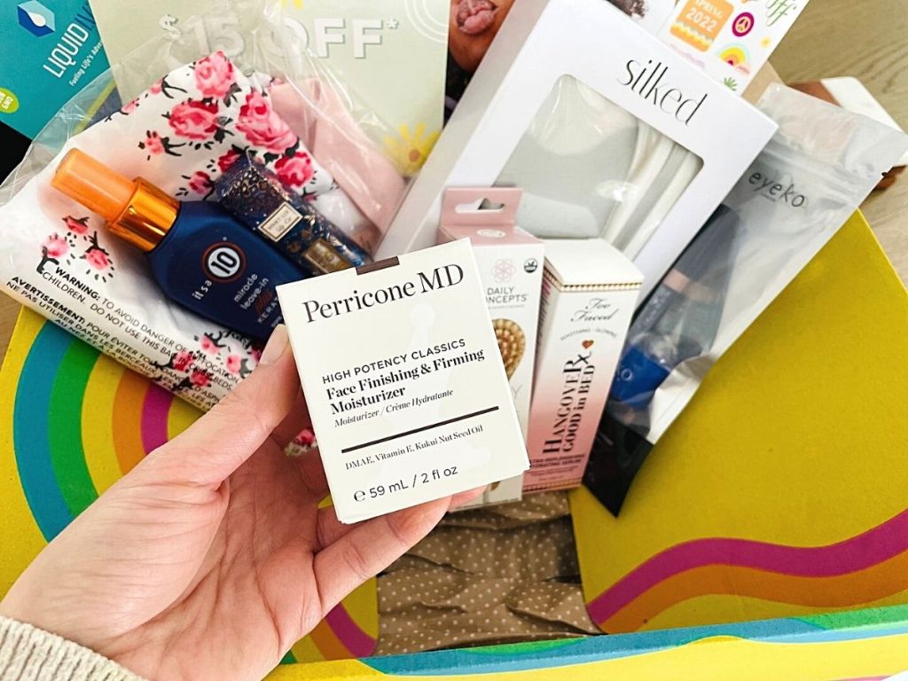 woman holding upPerriconeMD product wtih fabfitfun in background