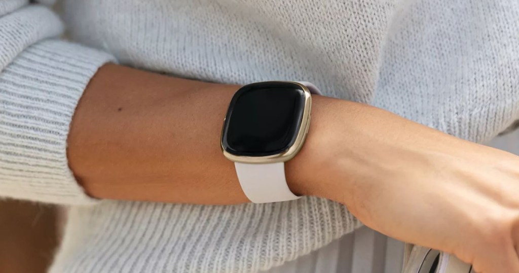 arm with sweater and smartwatch on