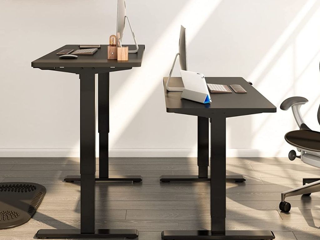 black standing desk fully extended and not extended