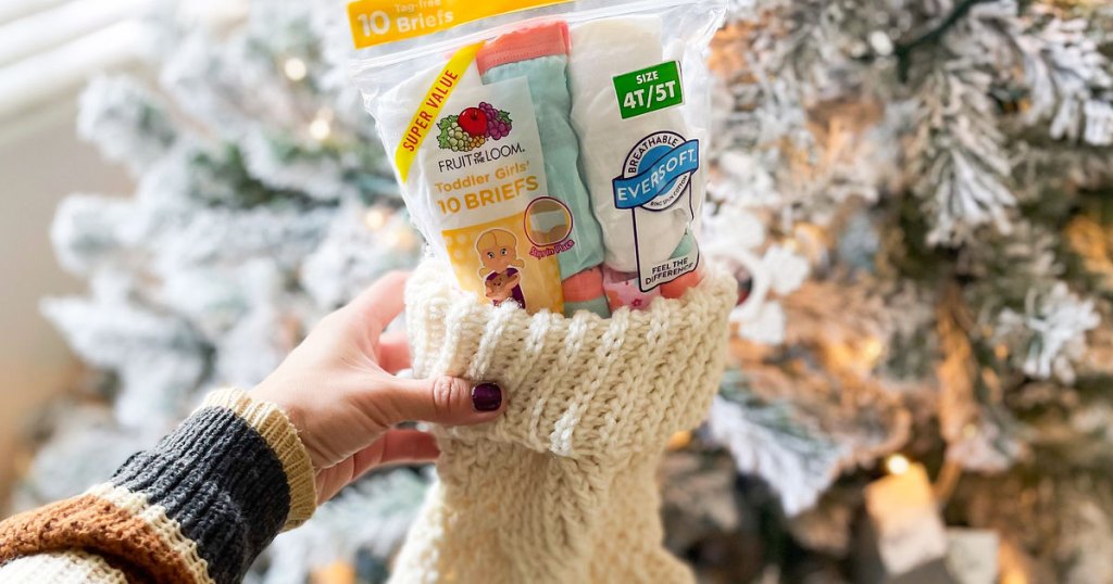 holding stocking with fruit of the loom underwear inside