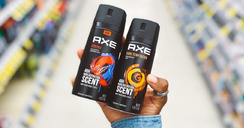 Hand holding two Axe Body Sprays