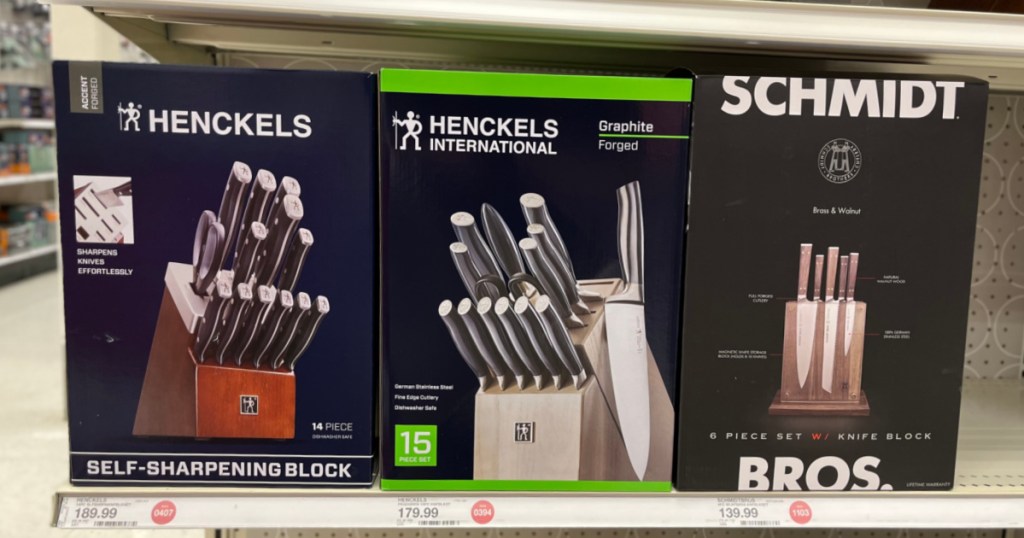 three black boxes with knife sets 