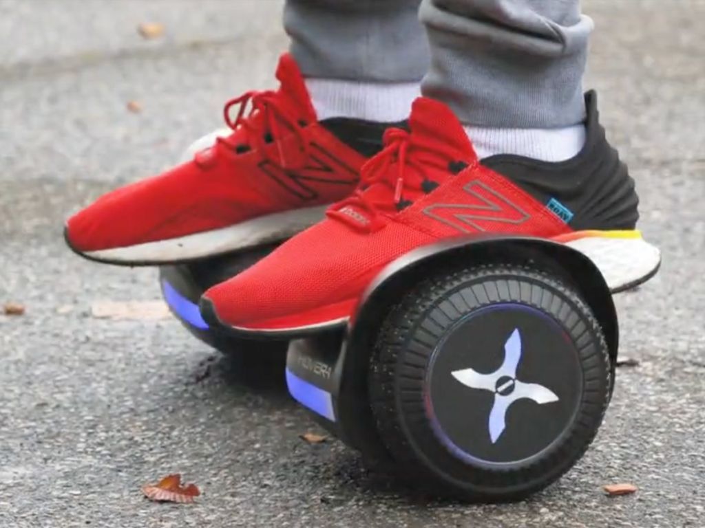 man's feet on a Hover-1 Blast Hoverboard