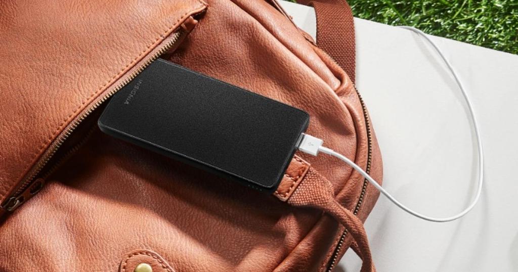 insignia 5,000 portable charger with usb cord plugged in