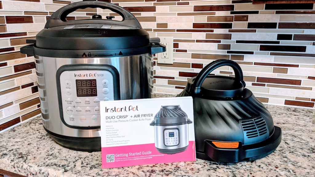 instant pot air fryer sitting on granite countertop with instruction packet