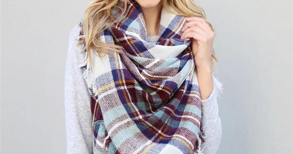 woman wearing soft plaid blanket scarf