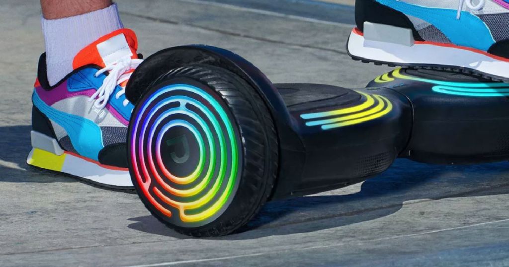 foot on rainbow colored hoverboard