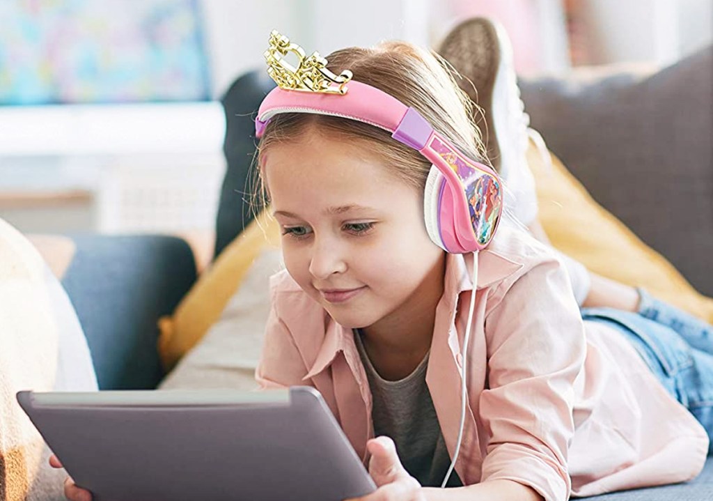 girl wearing headphones with princess crown