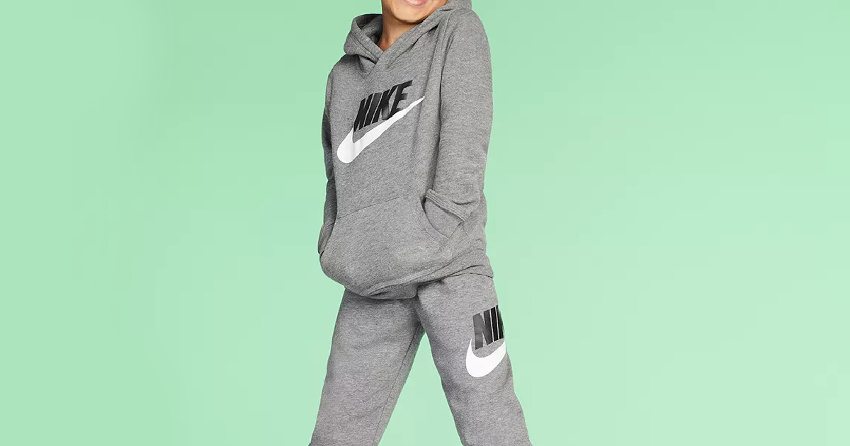 boy wearing matching gray joggers and hoodie