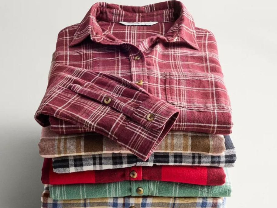 A stack of Sonoma folded plaid flannel shirts