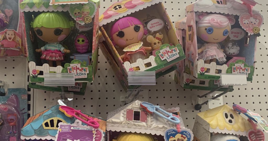 dolls in box on shelf 