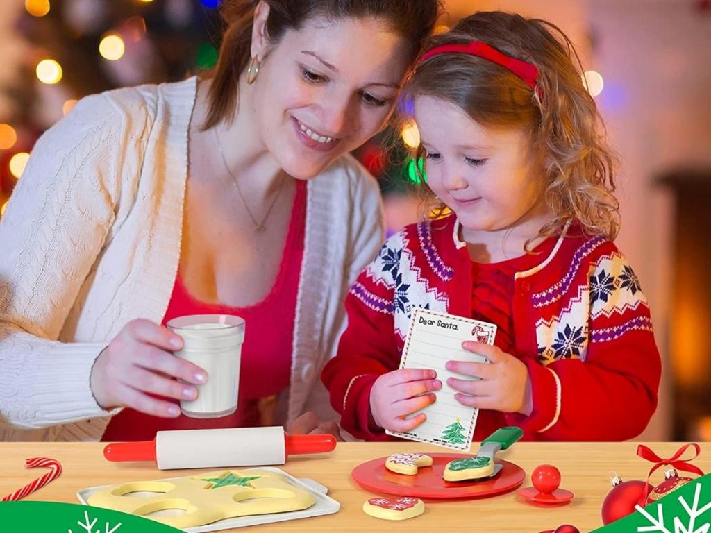 mom and daughter with learning resources santa's cookies set
