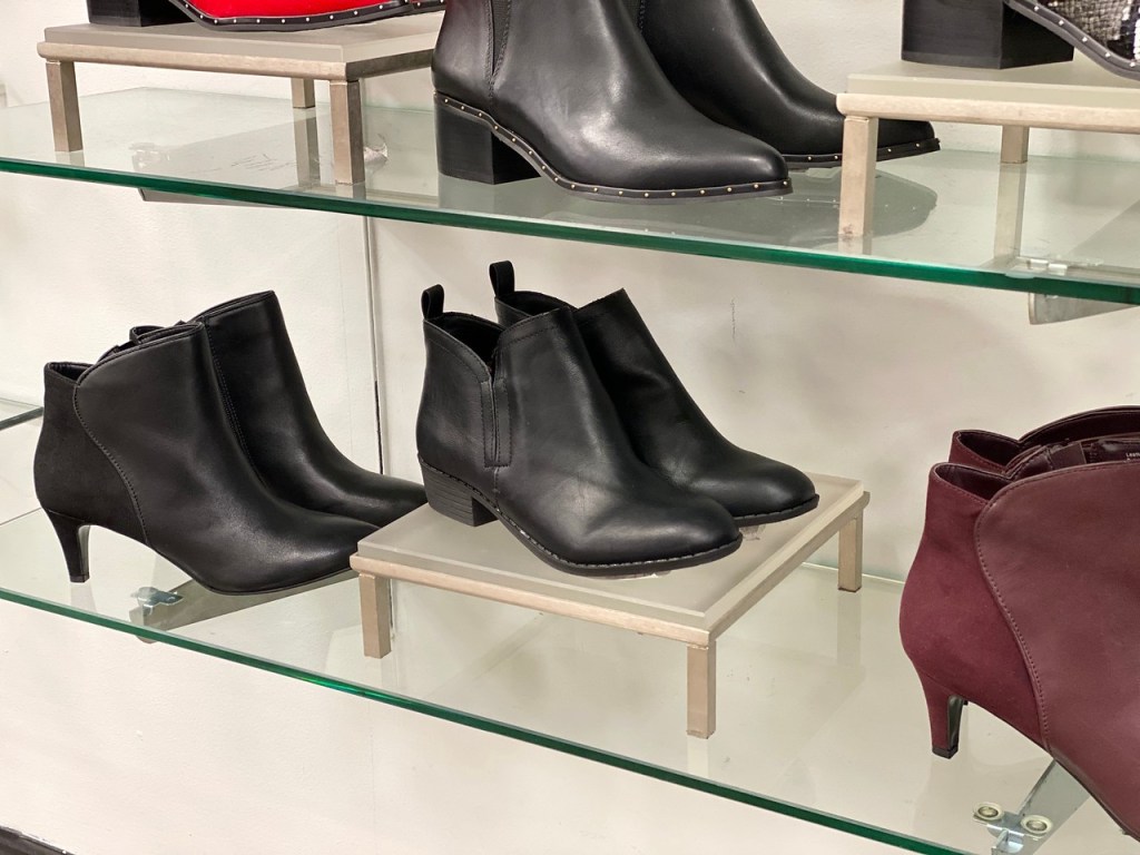 Macy's Cadee Boots on display shelf at store