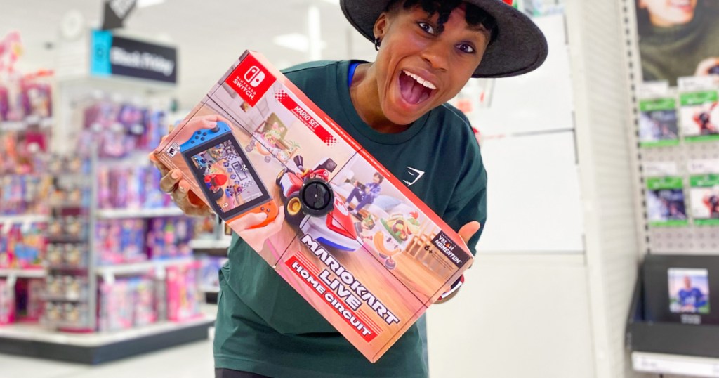 Woman holding Mario Kart Live Home Circuit Game