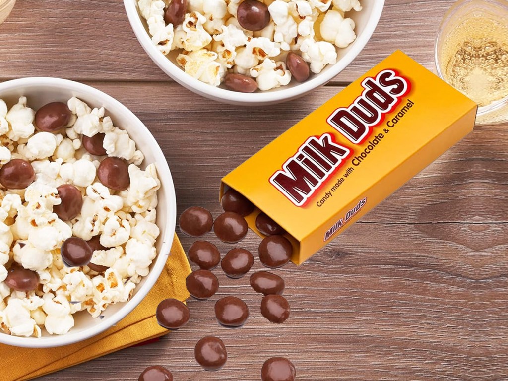 milk duds candies spilling out from box