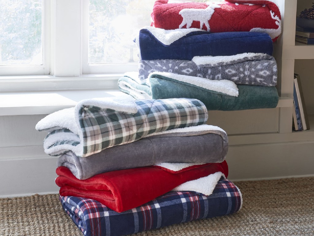 stack of folded blankets in home