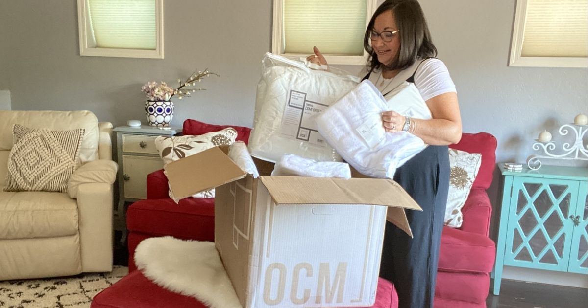 womn unboxing an order from OCM