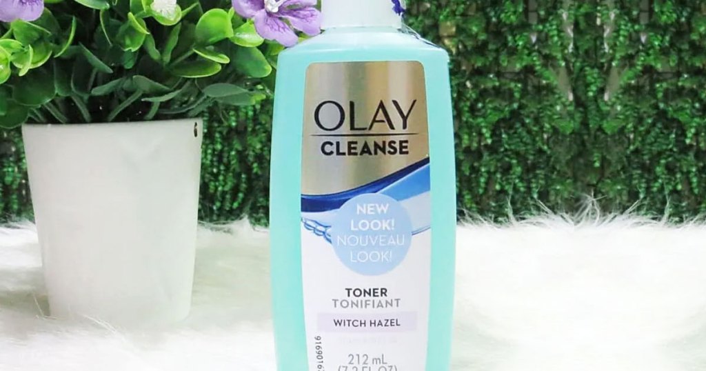 bottle of olay cleanse toner near potted plant