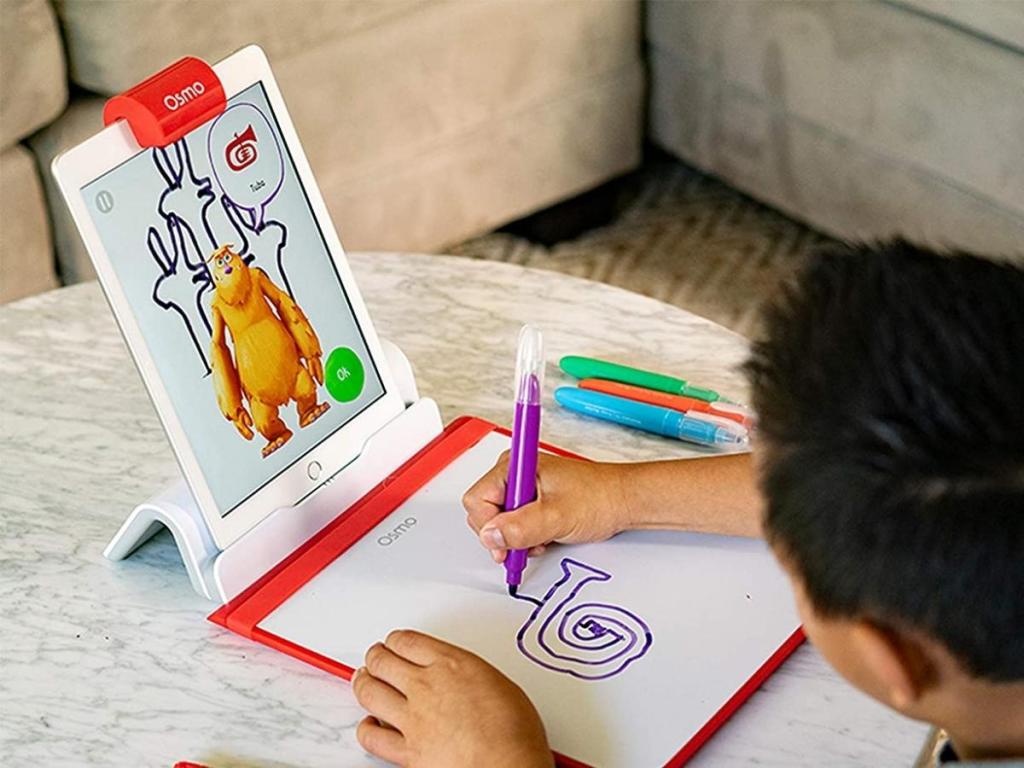 boy playing with osmo creative starter kit
