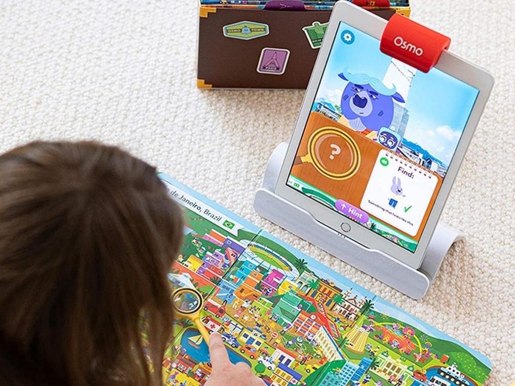 child playing osmo detective agency game
