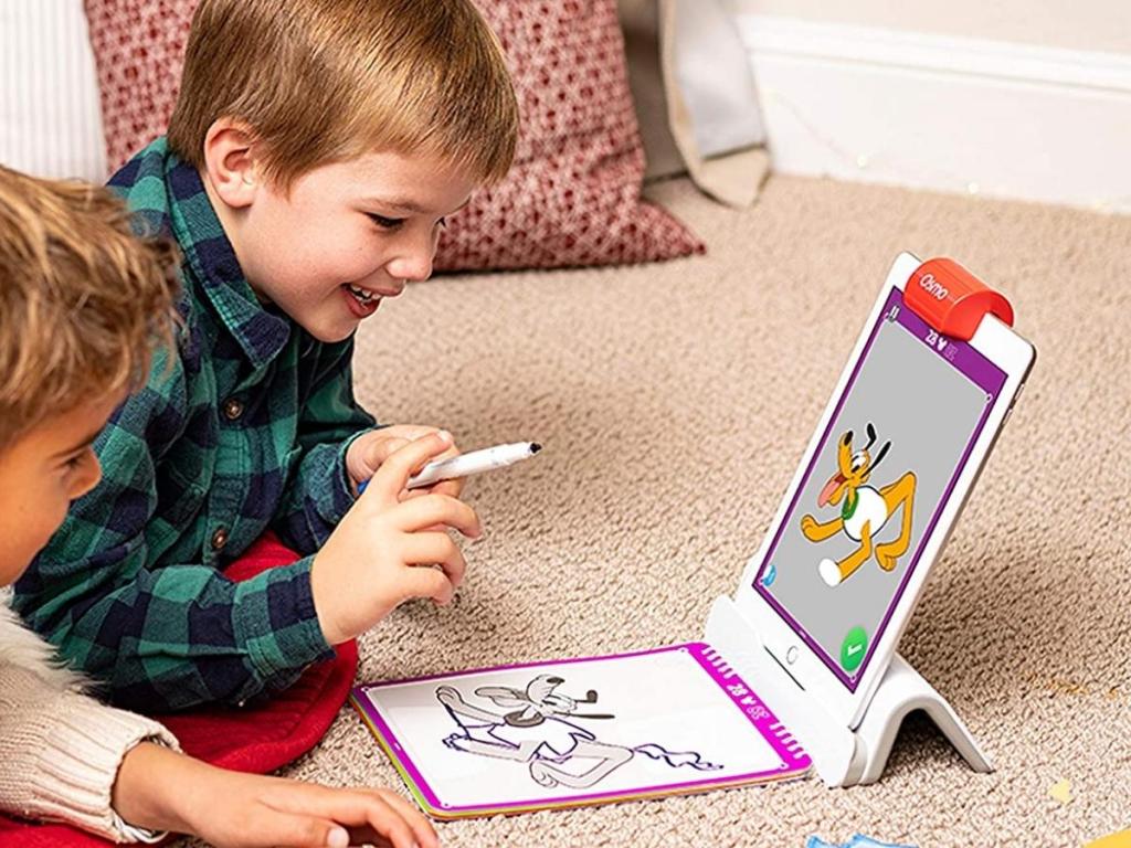 boys playing with osmo disney mickey and friends super studio game