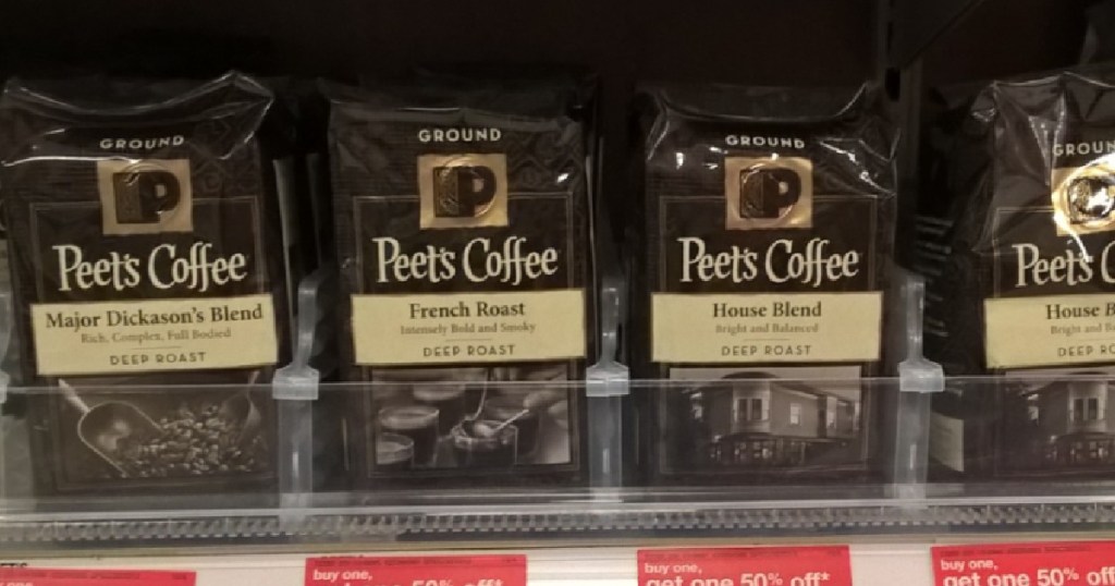 brown bags of ground coffee on shelf 