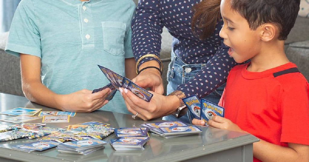 people playing with pokemon cards 