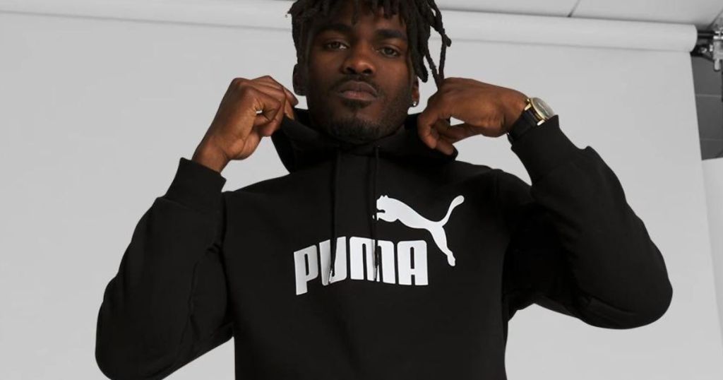 Man wearing a black puma hoodie