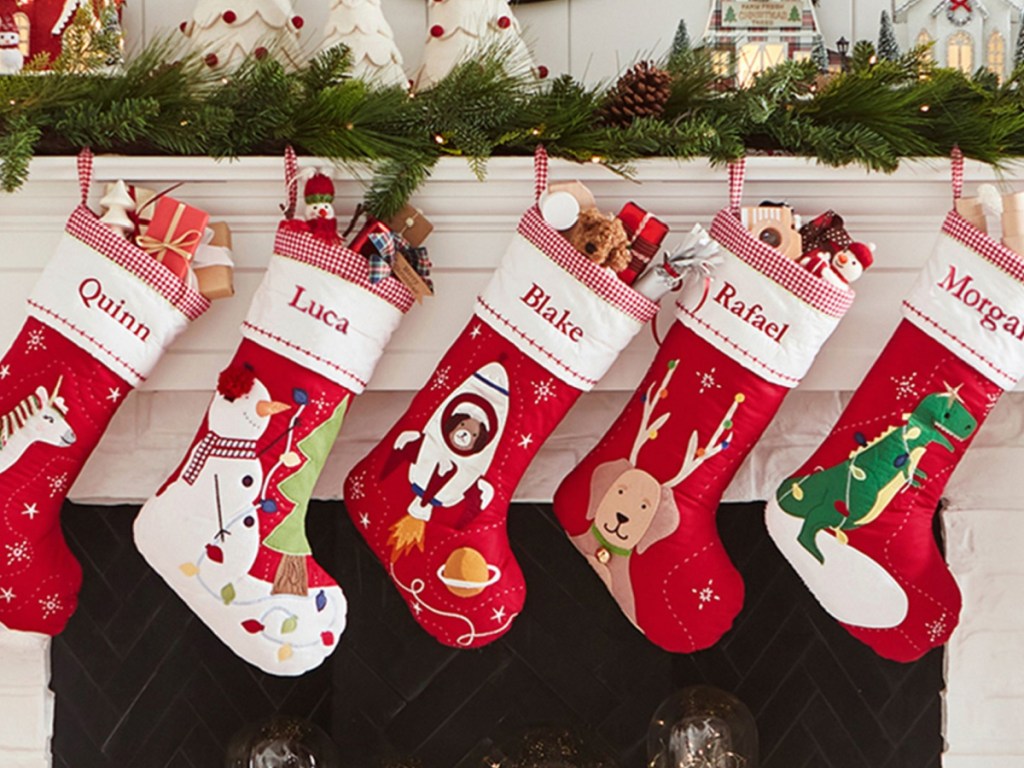 Quilted Christmas Stocking Collection on fireplace mantel