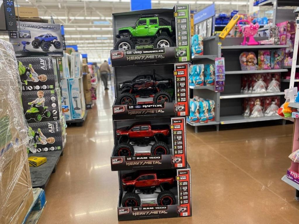 new bright rc toy trucks stacked in store aisle