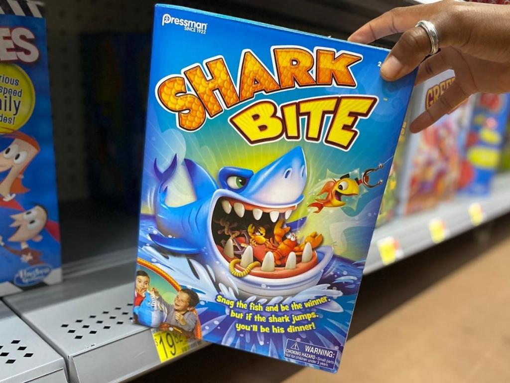 hand holding shark bite game in store
