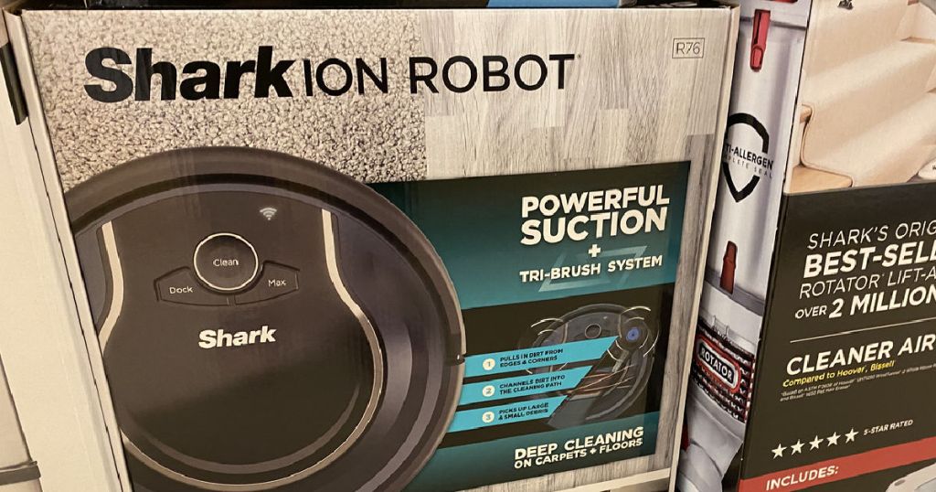 black robot vacuum on shelf 