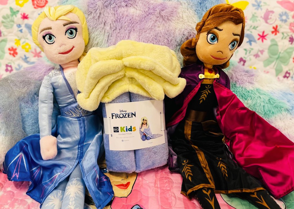 hooded blanket next to frozen plush dolls