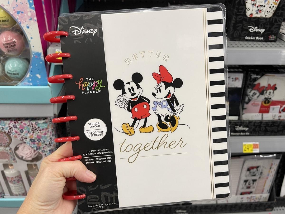 hand holding the happy planner disney mickey and minnie better together planner