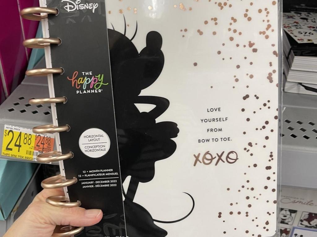 hand holding the happy planner disney minnie mouse classic planner