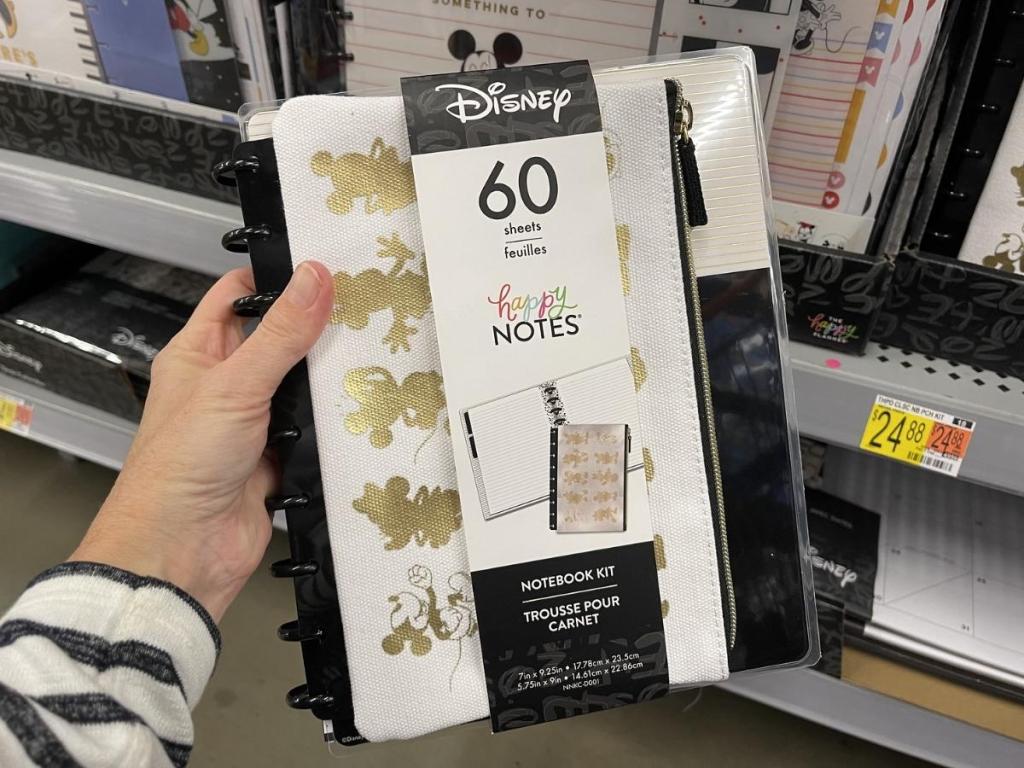 hand holding the happy planner disney notebook
