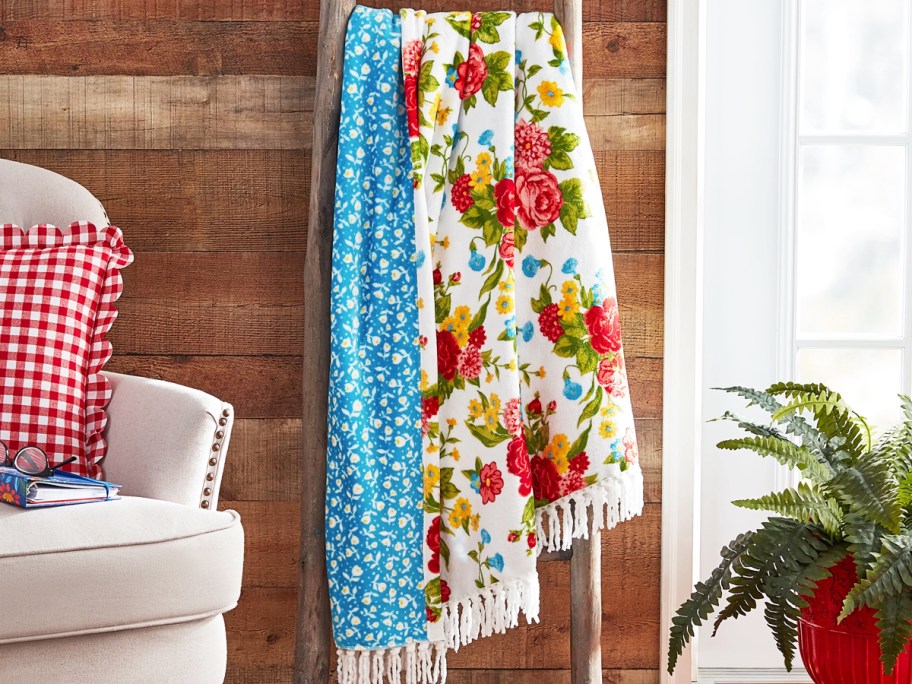floral print throw draped over blanket ladder
