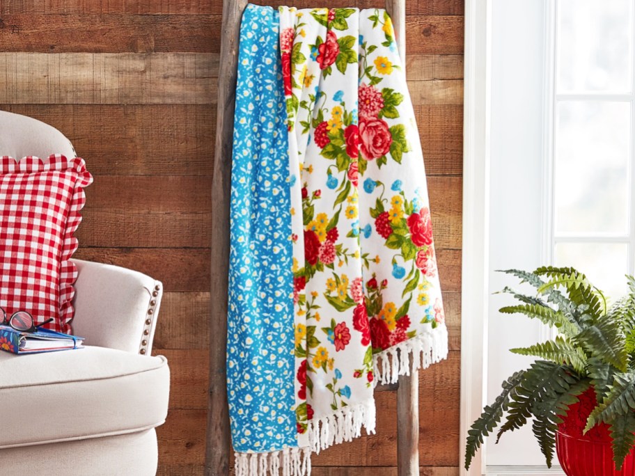 floral print throw draped over blanket ladder