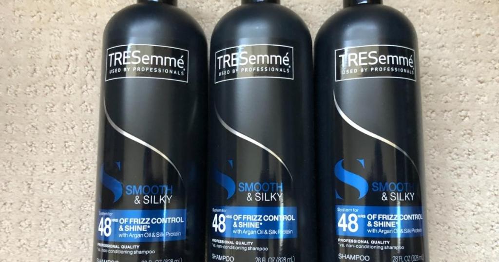 three bottles of tresemme smooth and silky shampoo