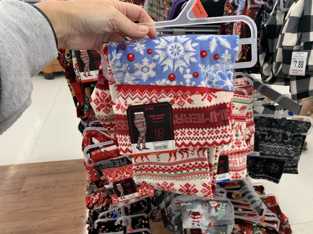 Person holding up pair of Holiday Leggings from Walmart