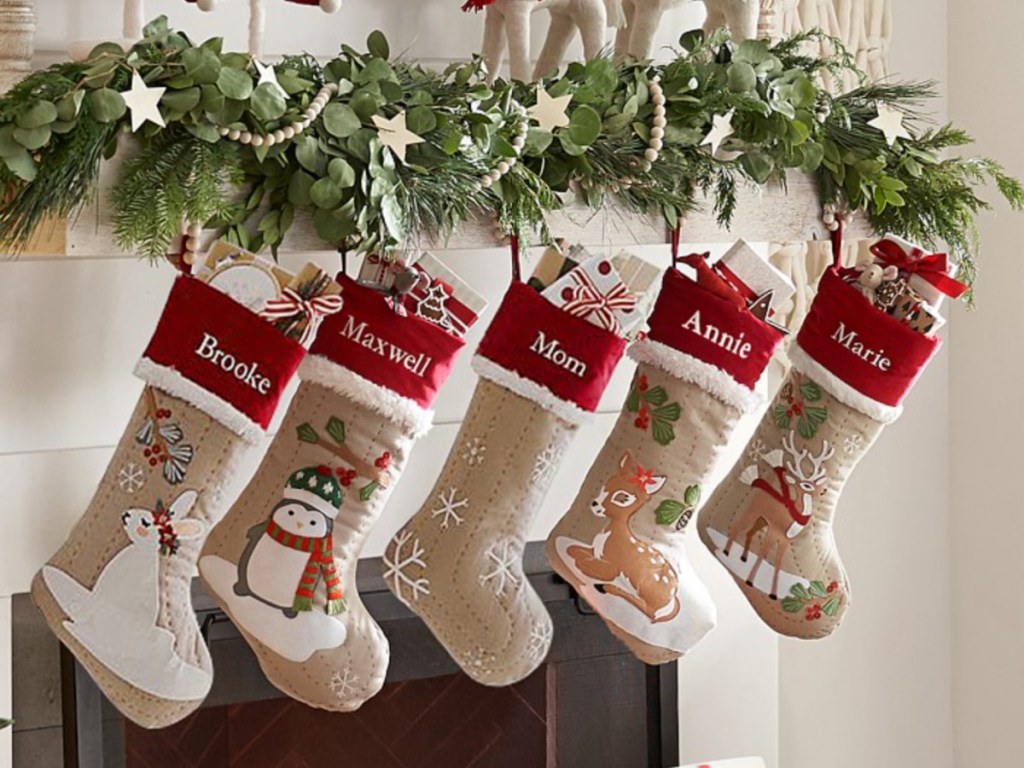 brown and red christmas stockings hanging from mantel